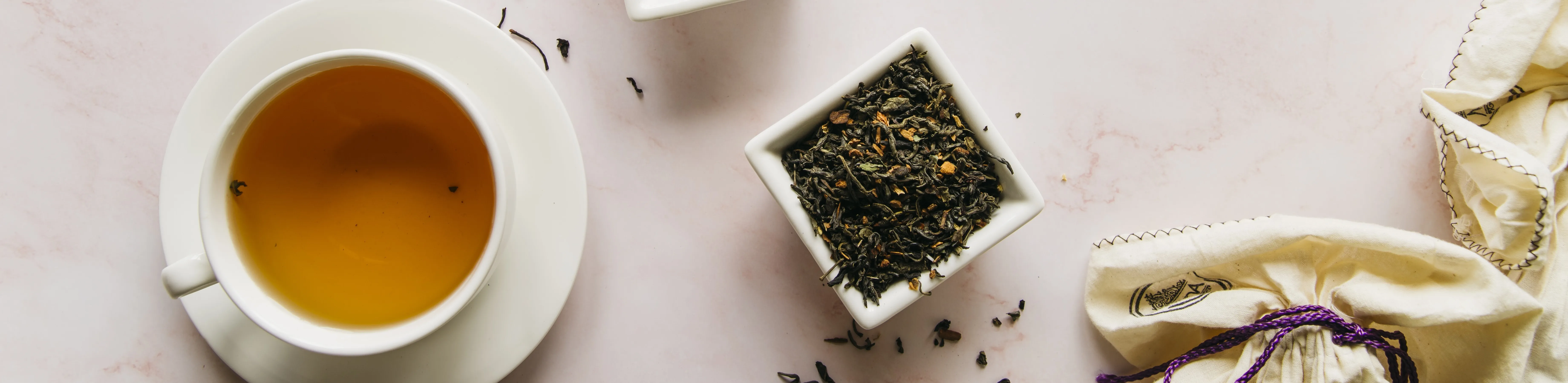 dried-tea-herbs-bowl-with-black-tea-marble-texture-backdrop.webp